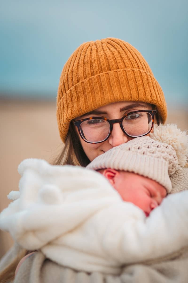 A woman holding a baby in her arms