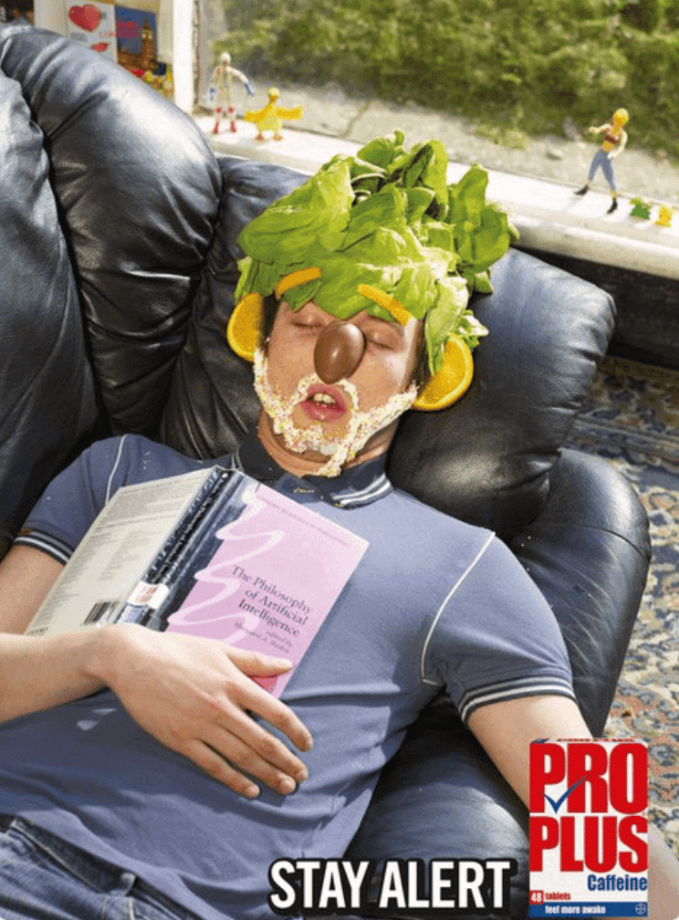 A man asleep with lettuce on his face because he didn't take pro plus