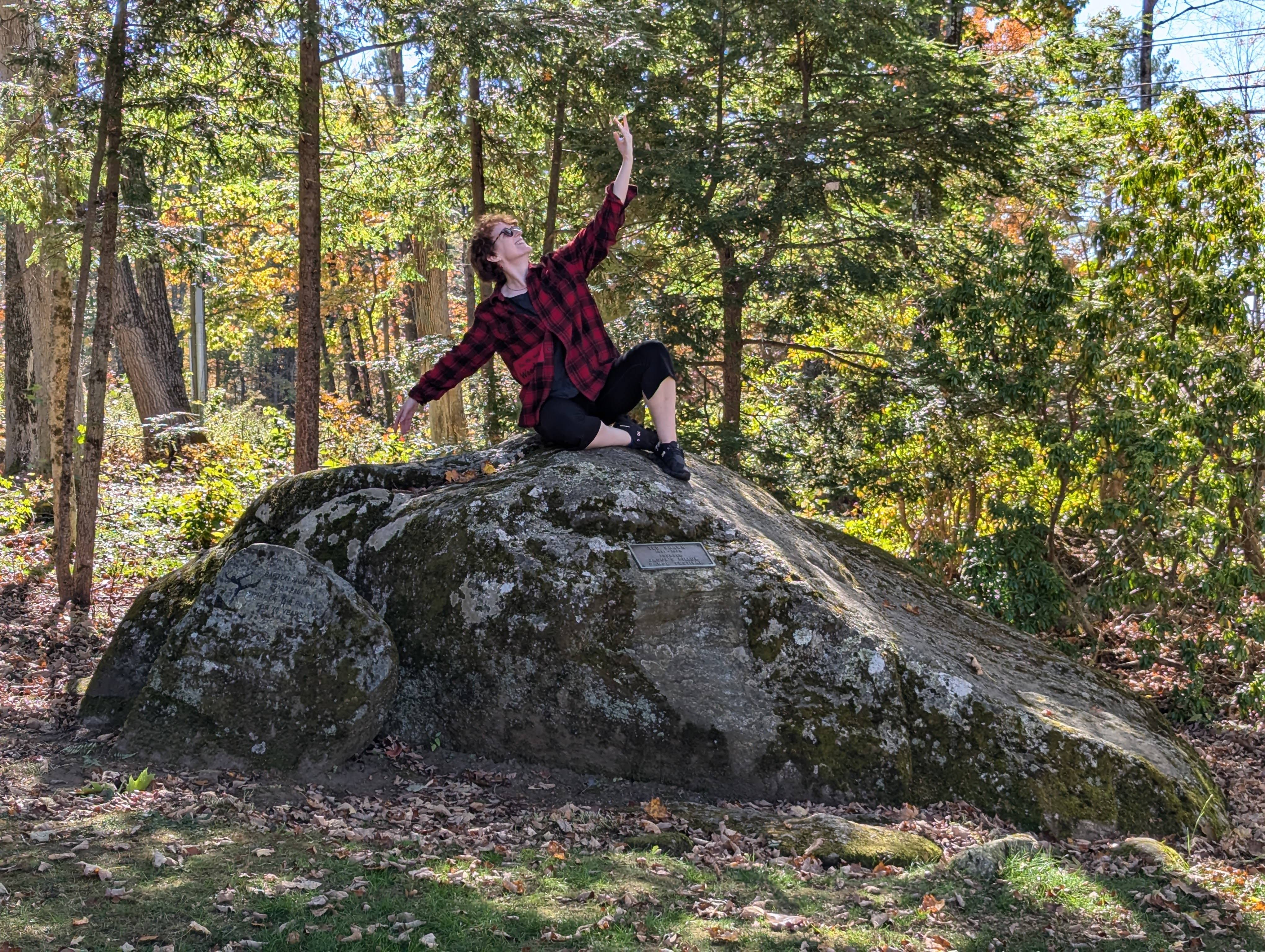 Woman sitting on rock