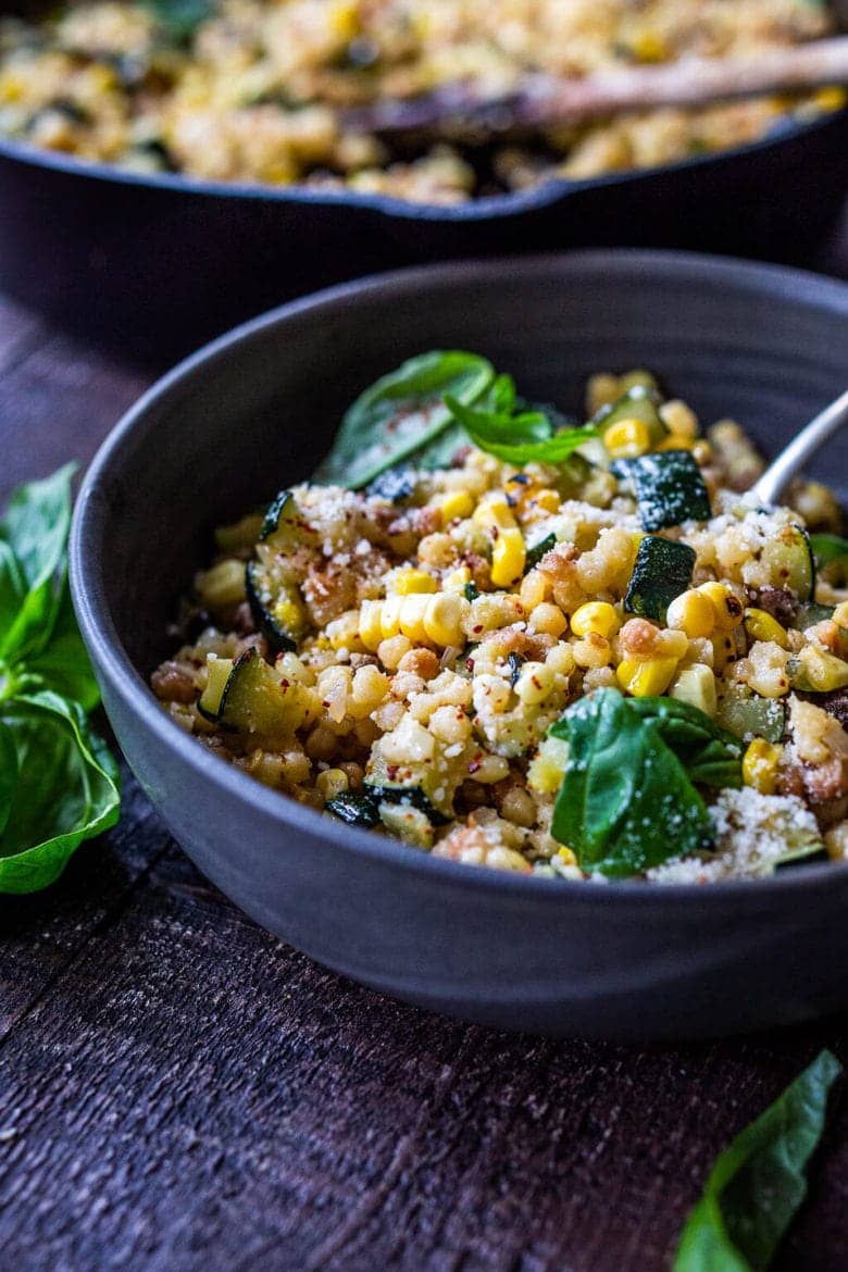 Fregola pasta with corn and zucchini