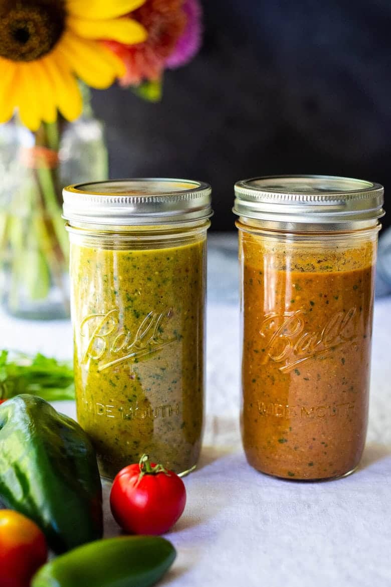 Red and green enchilada sauce in jars