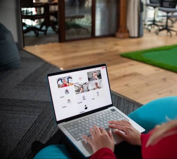 Woman on laptop in video conference call