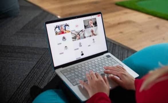 Woman on laptop in video conference call
