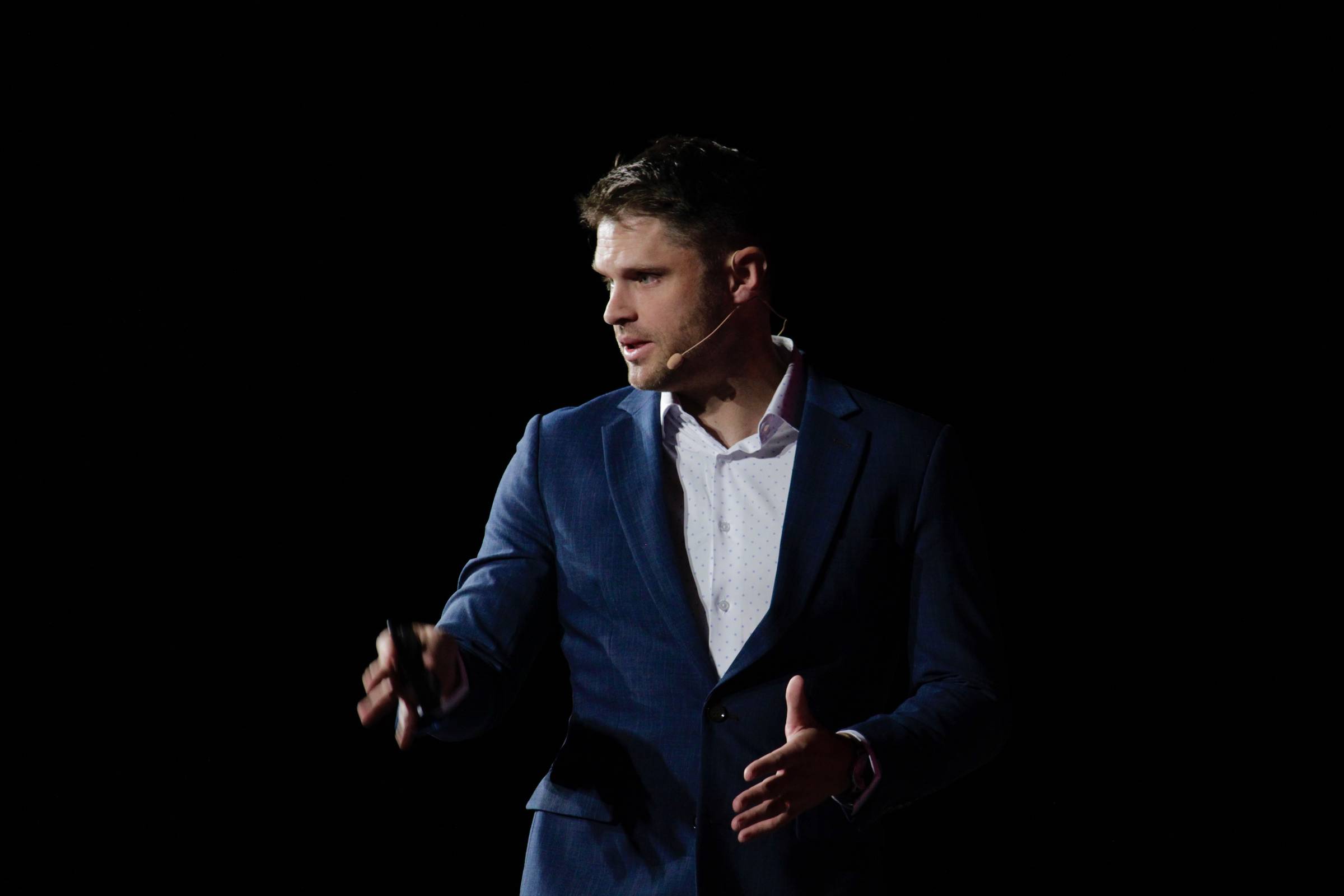 Charlie Hoehn speaking on stage