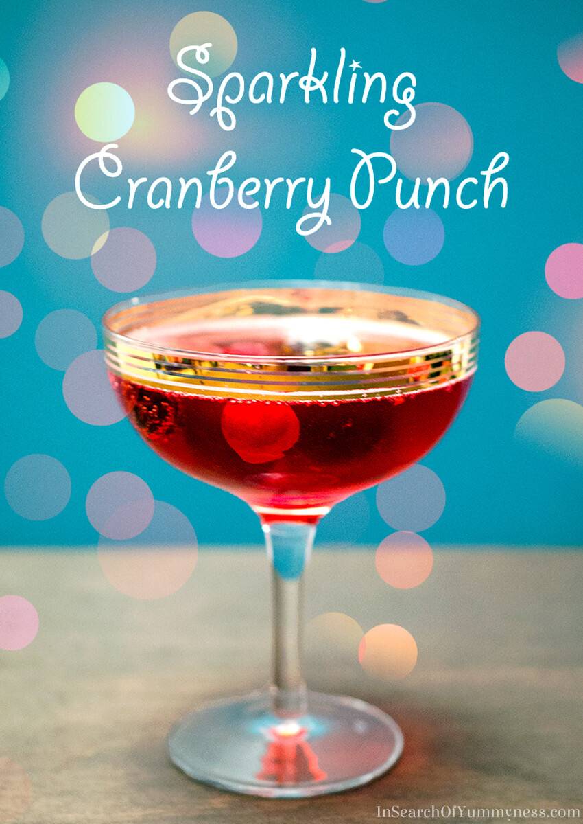 A fancy glass full of cranberry punch.