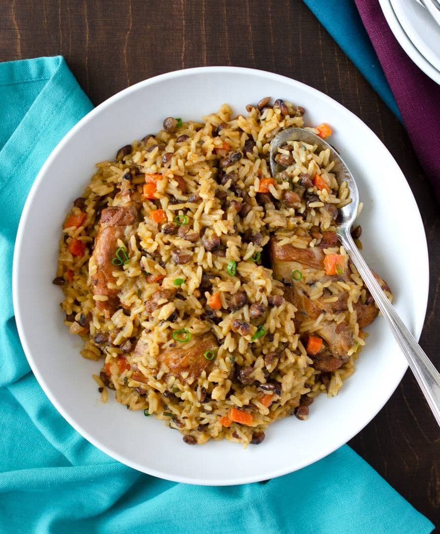 A plate full of Trinidadian pelau made with chicken, pigeon peas and rice.