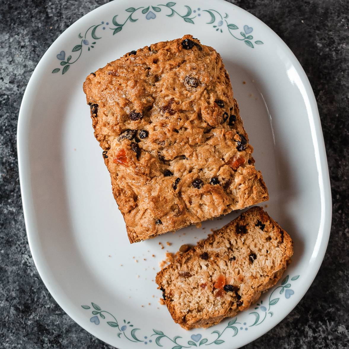A loaf of Trinidadian sweet bread on a cooling rack.