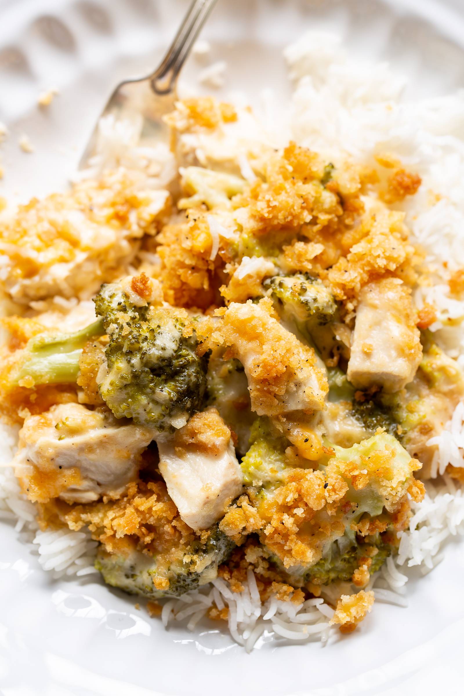 A bowl of chicken divan served over rice