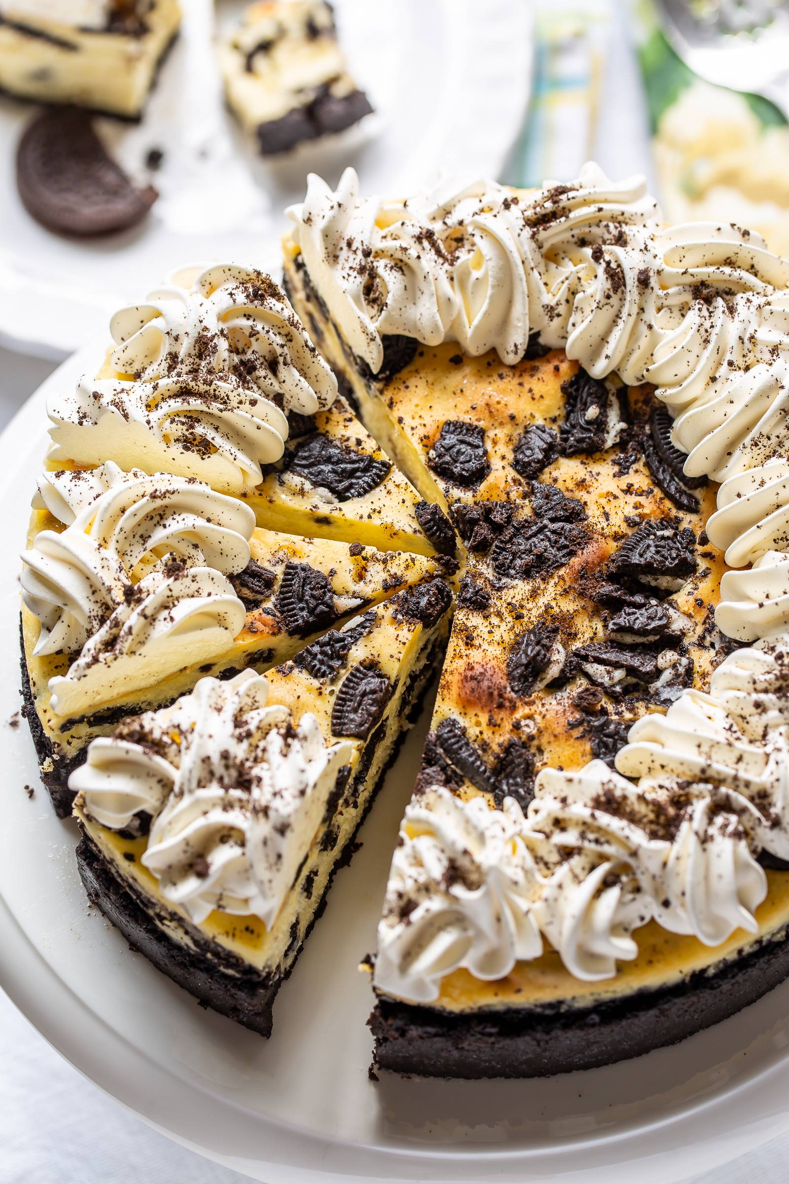 Oreo Cheesecake sliced on a cake stand