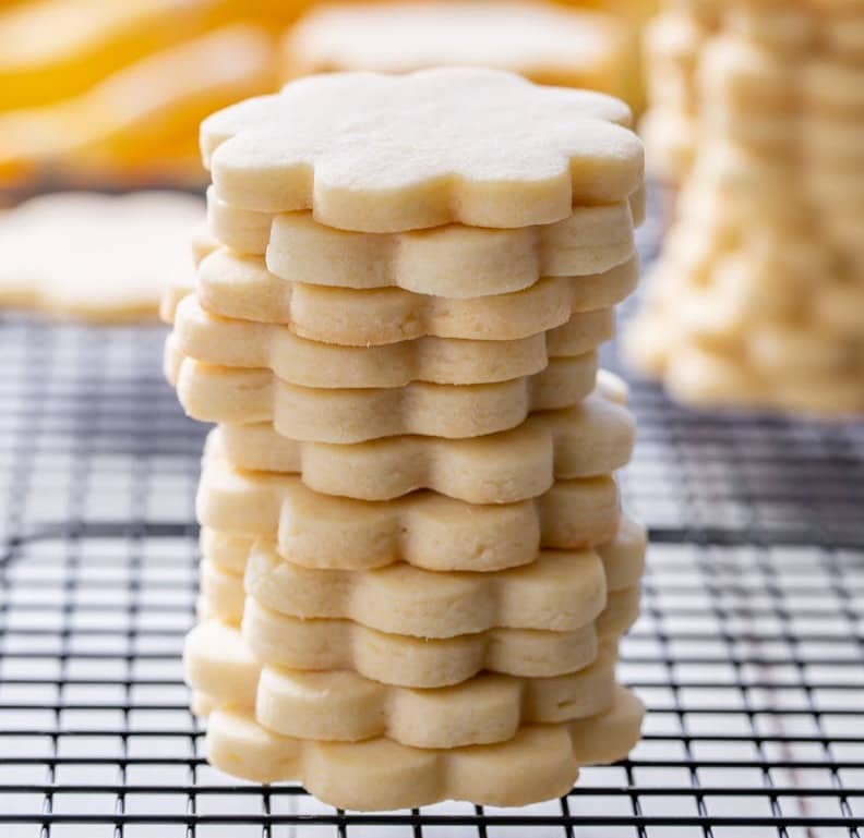 A stack of cut-out sugar cookies