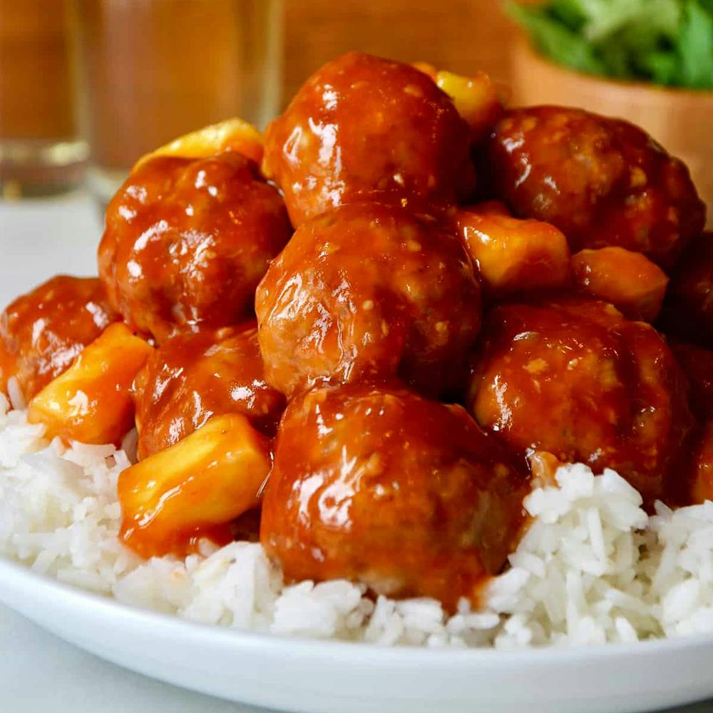 Baked sweet and sour meatballs with pineapple.