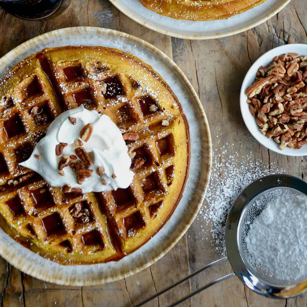 Thick butterscotch sauce drizzled over vanilla ice cream .