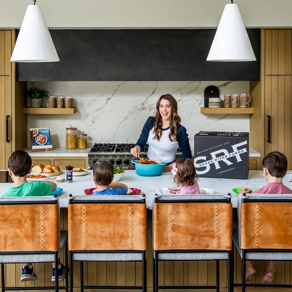 Kelly Senyei at her kitchen island with her four children.