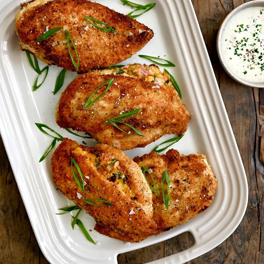 A tall stack of zucchini fritters.