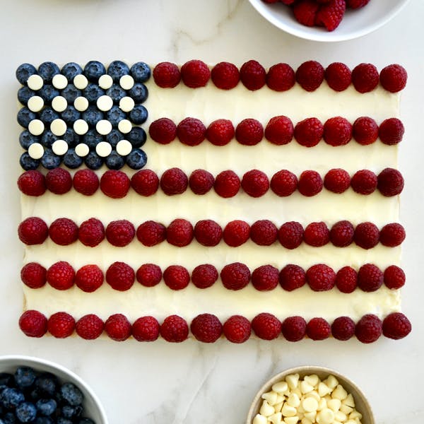 American flag cookie cake with blueberries and raspberries.