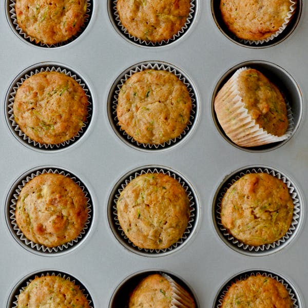 Zucchini Banana Muffins in a muffin tin.