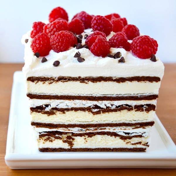 Easy ice cream sandwich cake topped with fresh raspberries and mini chocolate chips.