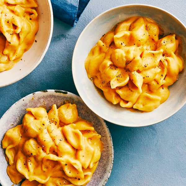 Two bowls containing pumpkin Mac and cheese.