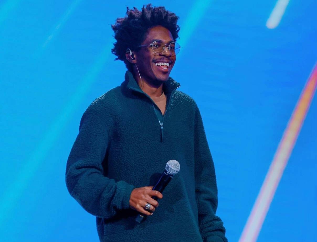 the ceiling of a building with a circular window
