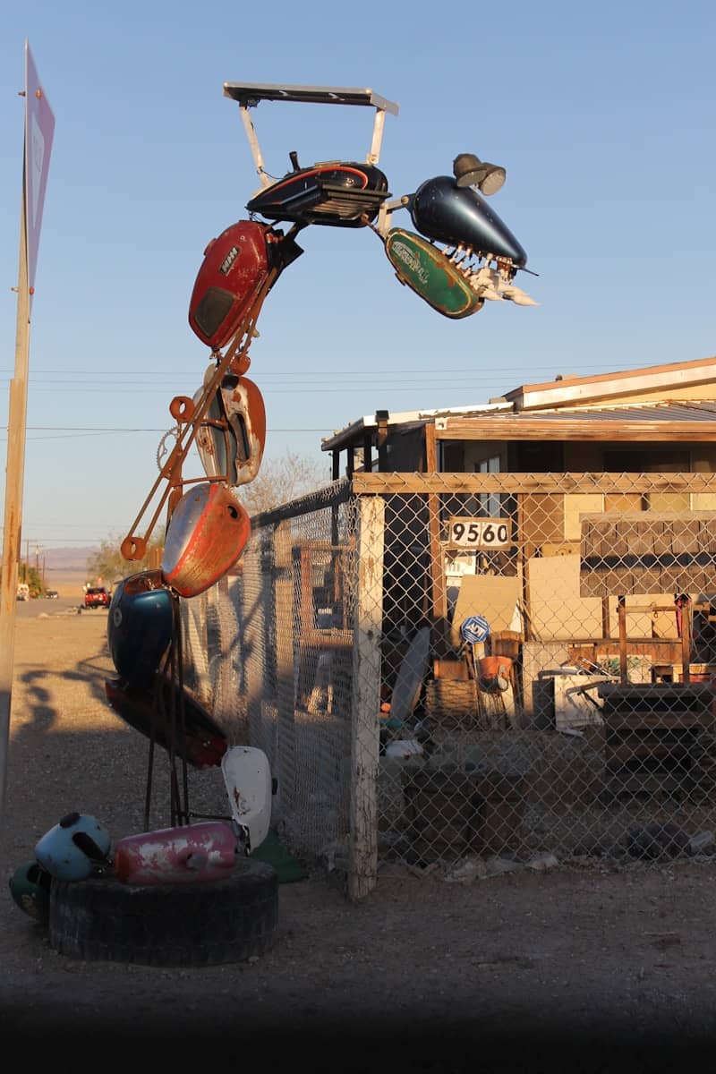 A sculpture made of motorcycle gas tanks is shown.