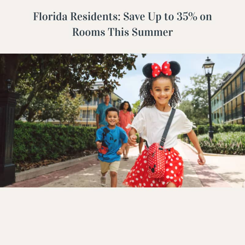 Little girls dressed as Mini Mouse running towards you with her family in the background