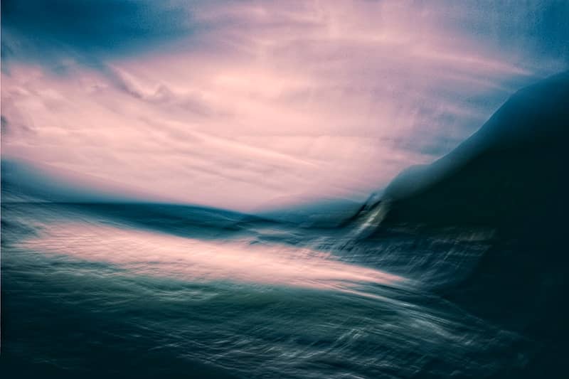 Abstract blurred landscape with pink and blue hues