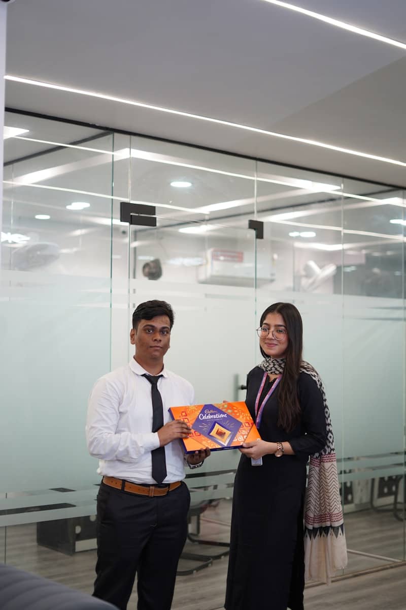 Man and woman holding a gift box