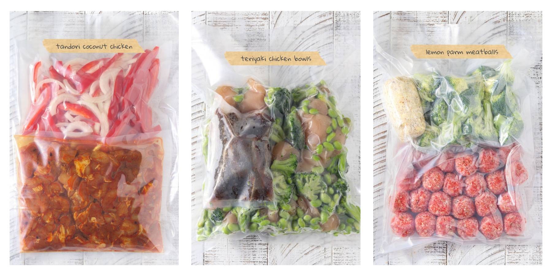 Three freezer meal starter bags labeled tandoori coconut chicken, teriyaki chicken bowls, and lemon parmesan meatballs arranged side by side on a white wood background. Each freezer bag contains prepped protein, vegetables, and sauce components ready for 