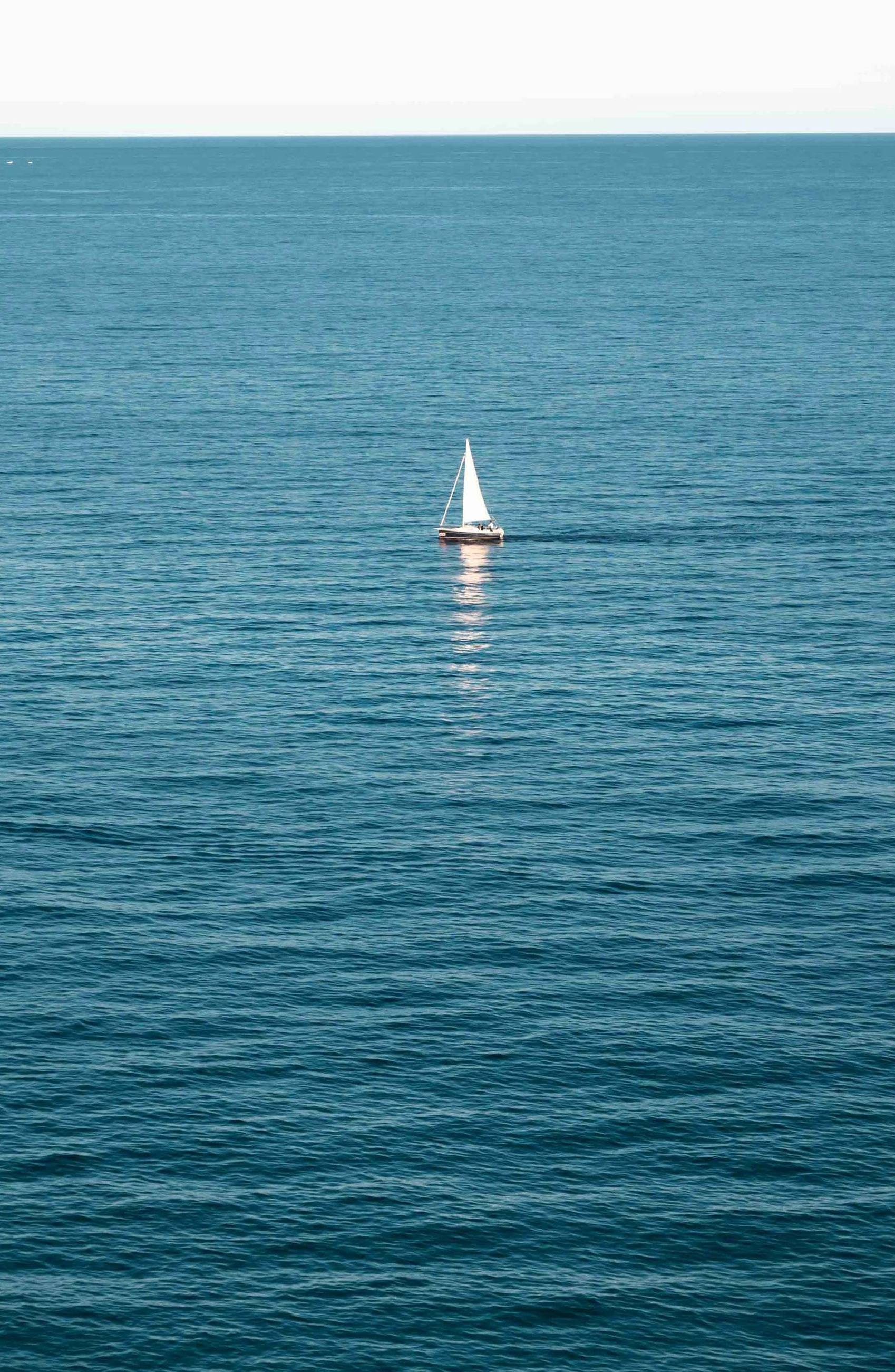 sail boat alone at sea