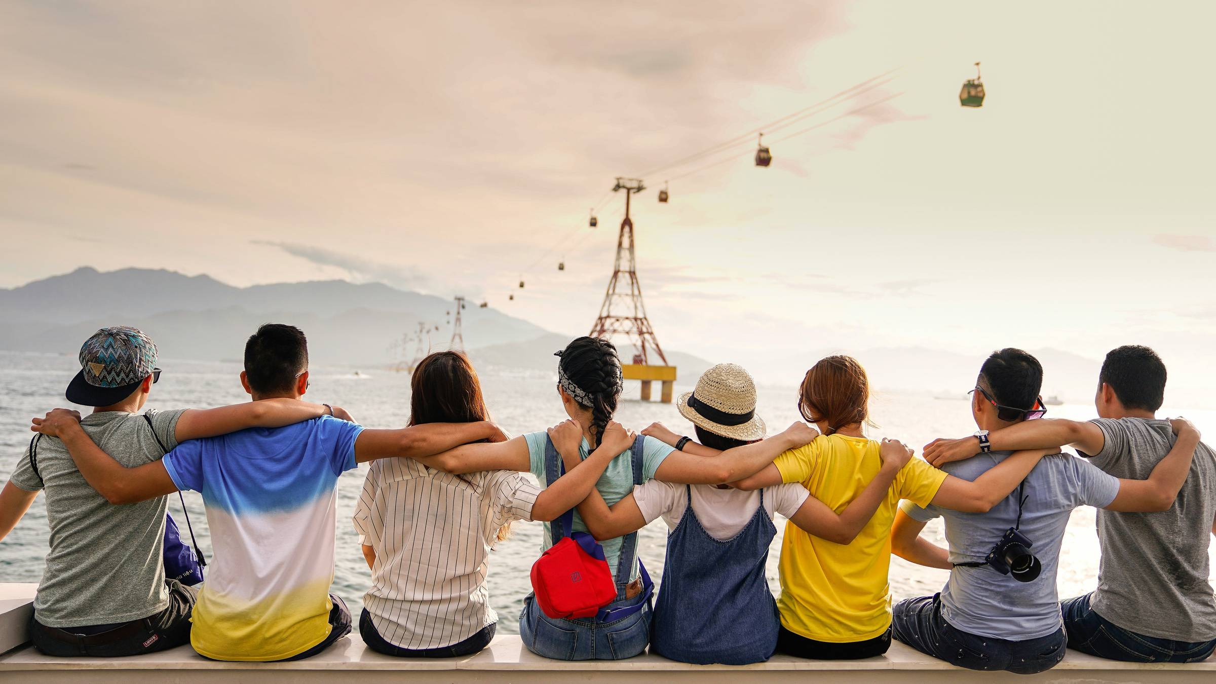 friends sitting arm and arm