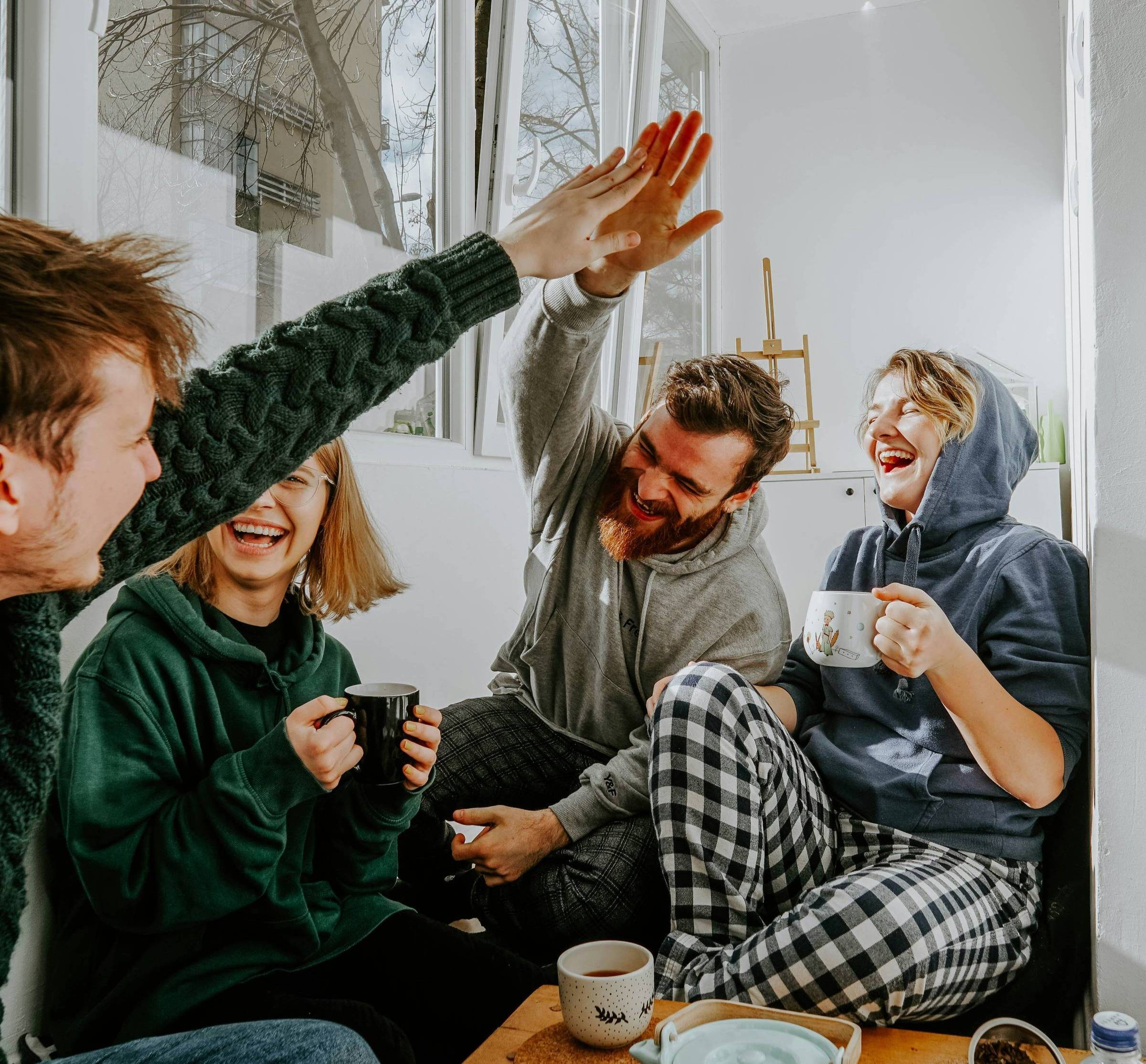 friends high fiving