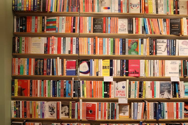 Bookshelves are packed with various colorful books.