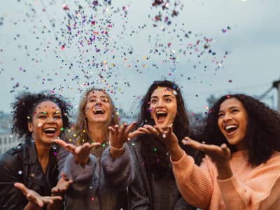 Women celebrating and throwing confetti