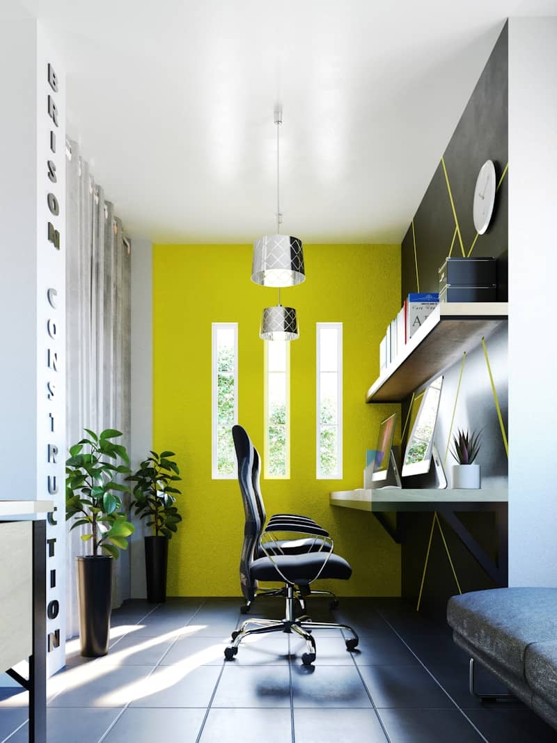 A room with a desk and a chair in it
