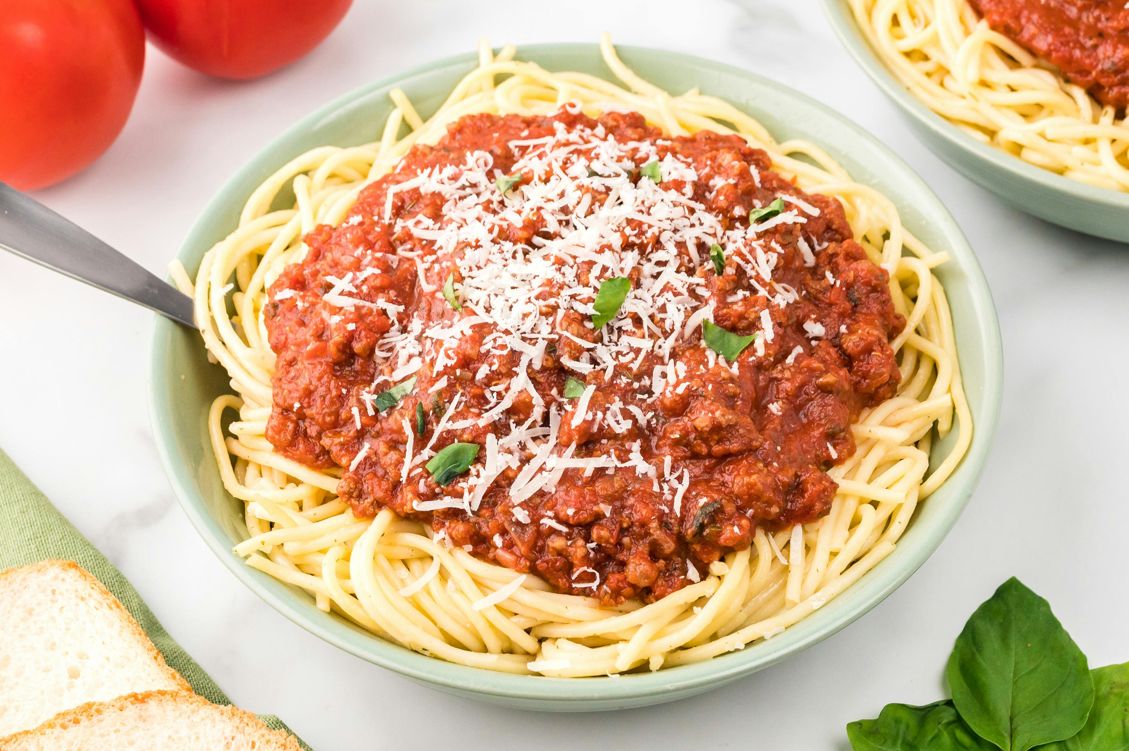 plate of bolognese over spaghetti