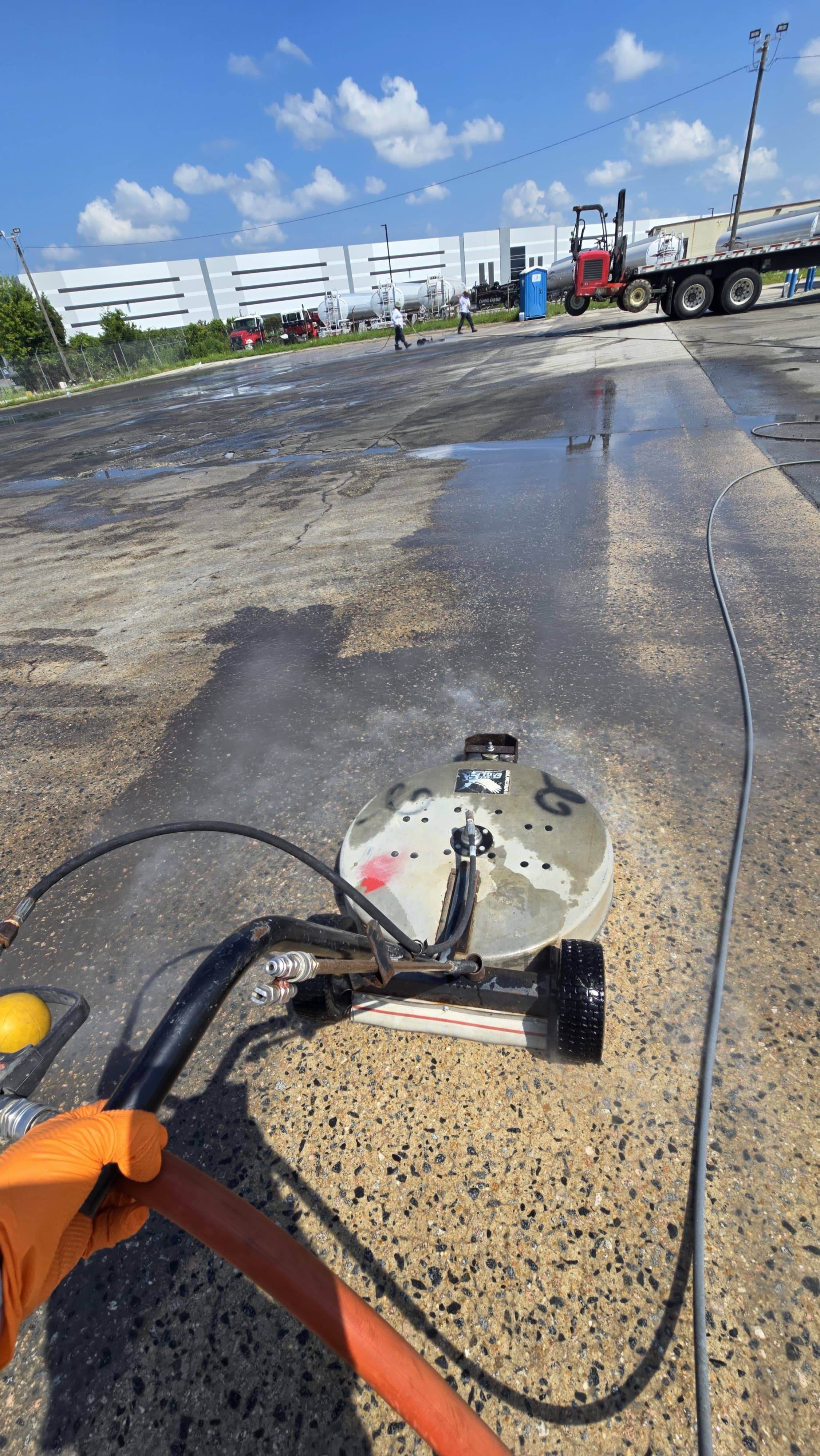 emergency oil spill being cleaned with high-pressure equipment and the Envirowash team