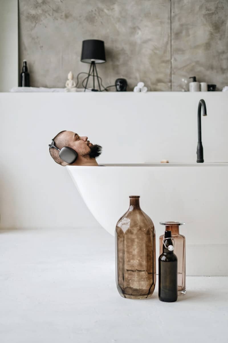 brown glass bottle on white table