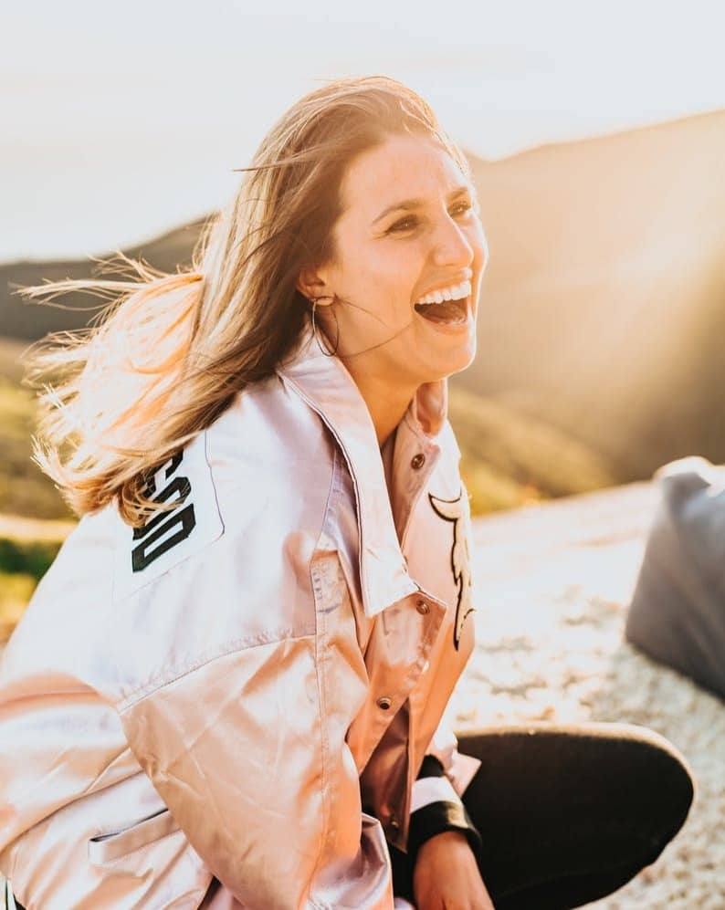 laughing woman while squatting