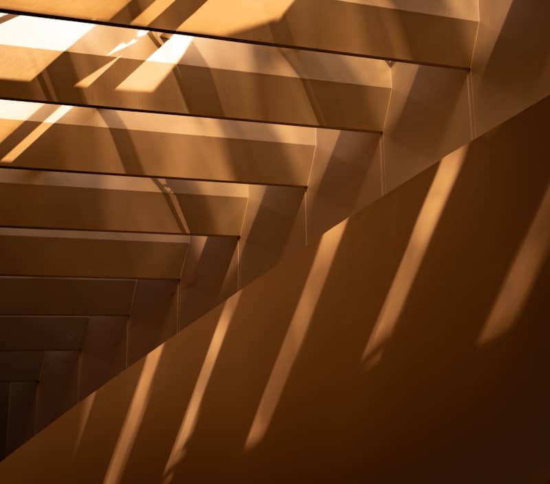 Geometric shadows cast on a textured wall