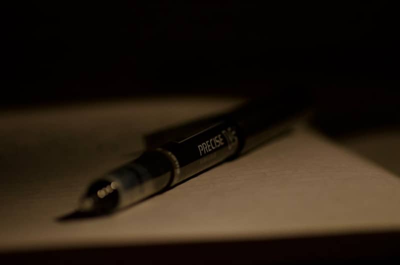 A close-up of a pen resting on paper.