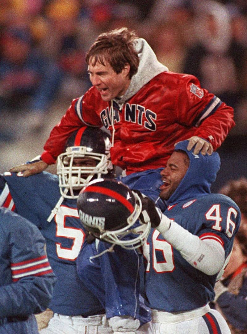 Bill Belichick lifted onto the shoulders of NY Giants' players in celebration of their victory over the Buffalo Bills