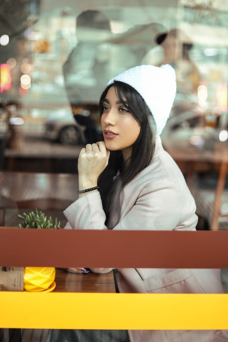 woman in white long sleeve shirt and white knit cap