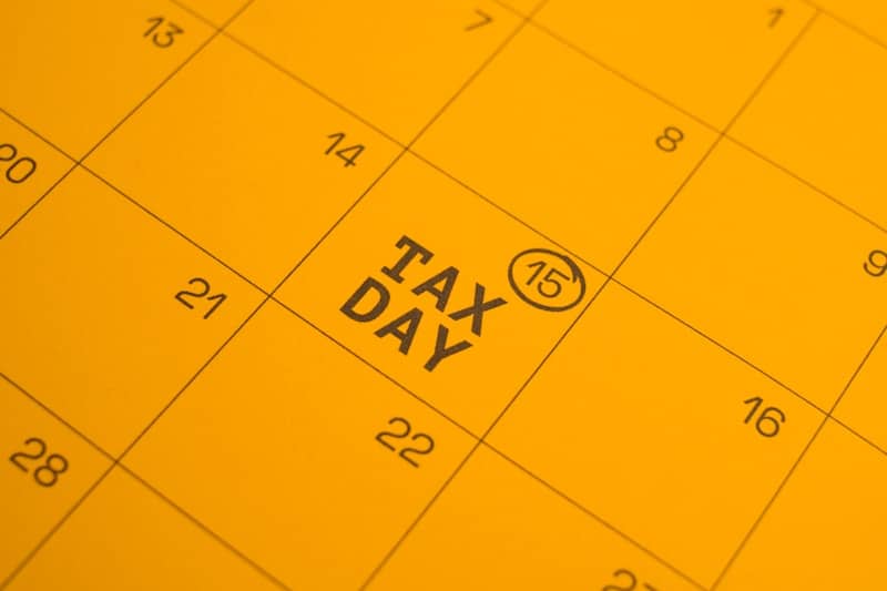 Calendar shows "tax day" circled on the 15th.