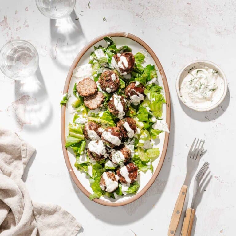 grilled meatballs on a serving platter