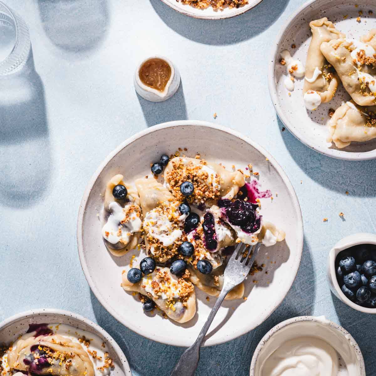 blueberry pierogi on a serving plate