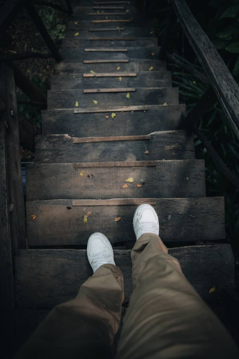 A person standing on a set of stairs