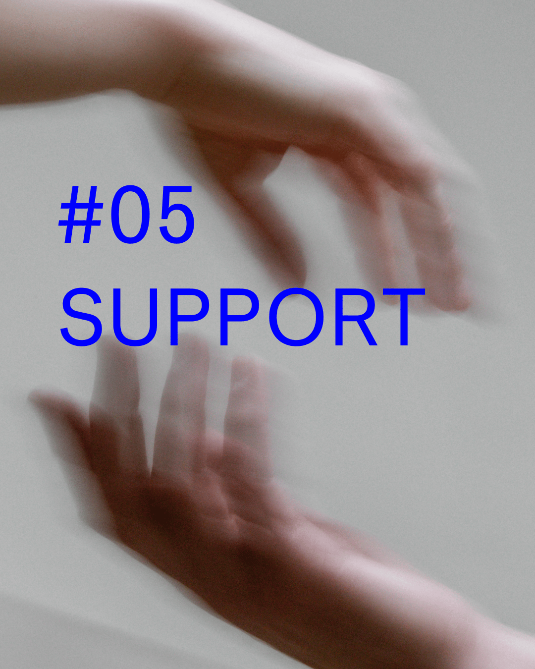two hands reaching for each other, blurred image
