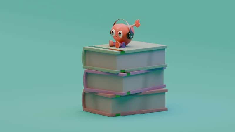 An orange creature with headphones on books.