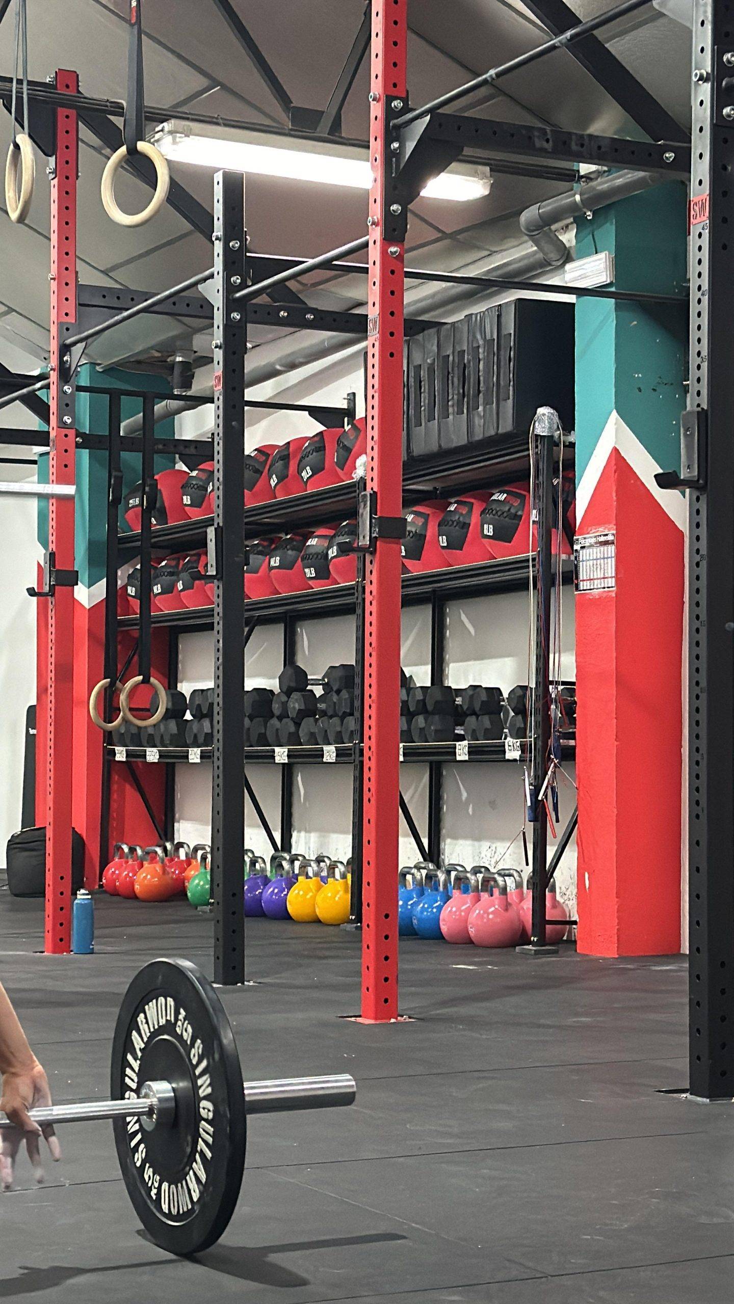 A cell phone sitting on top of a black clock