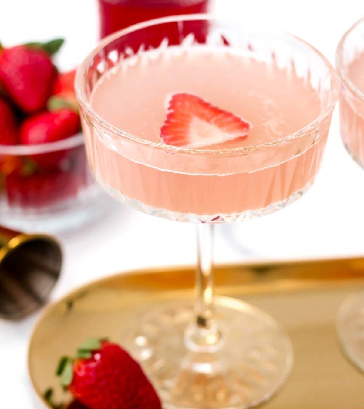 strawberry mocktail on a gold tray. 